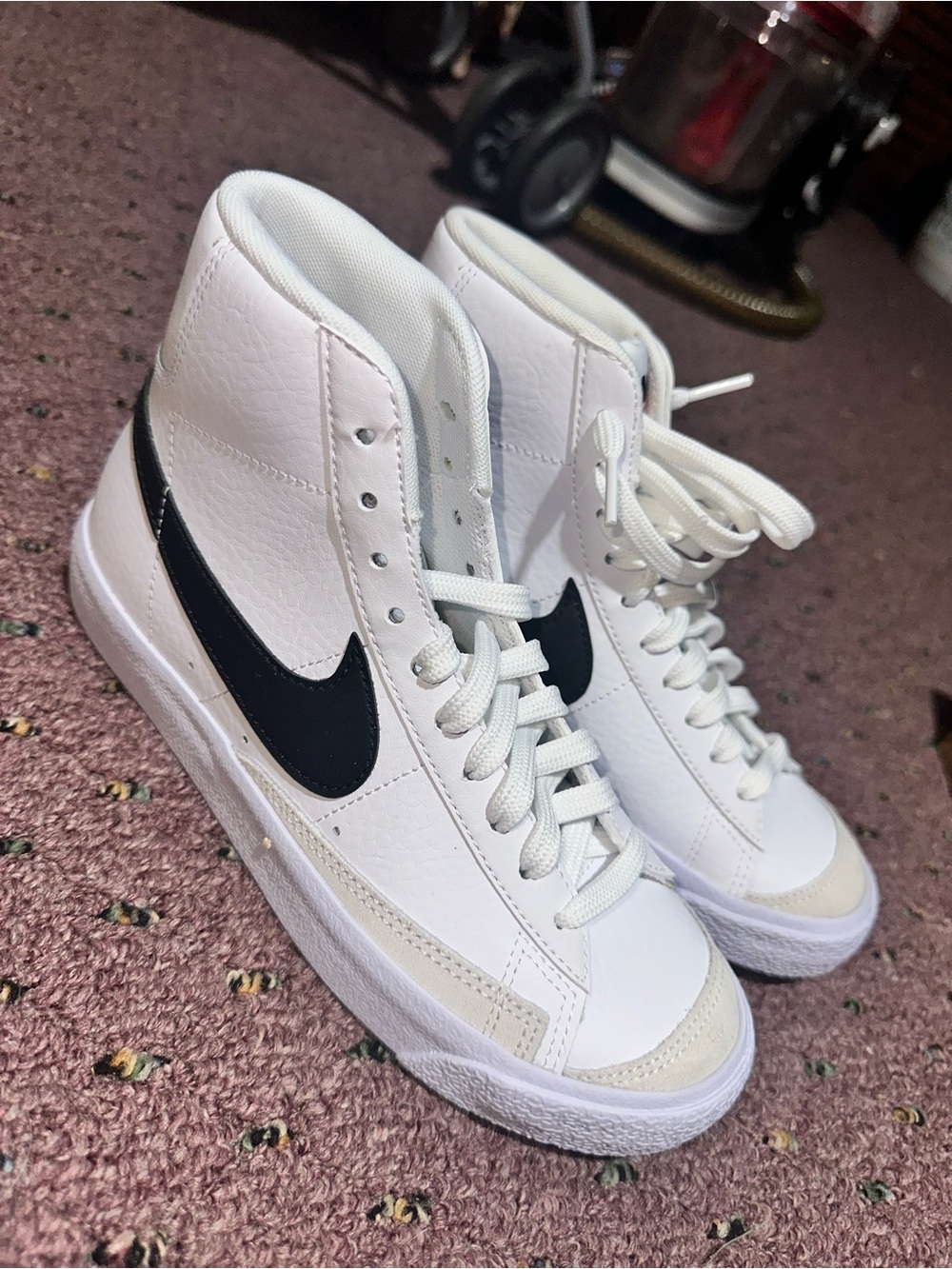 Nike White High-Top Sneakers with Black Swoosh